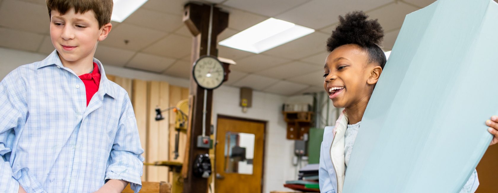 Students smiling in a classroom