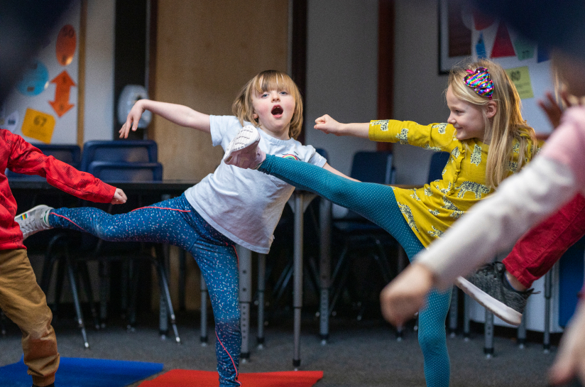 Students doing yoga during class