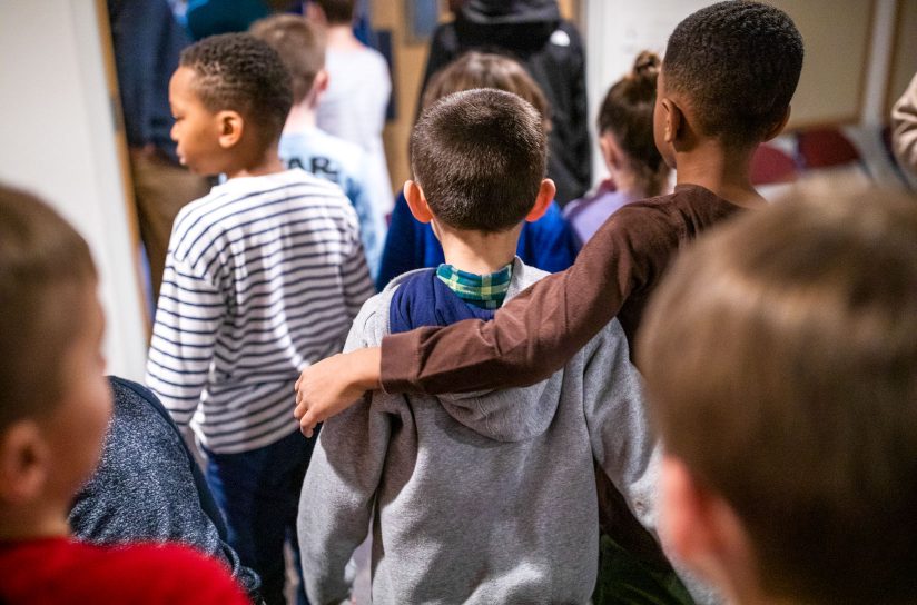 Students walking down the hallway together.