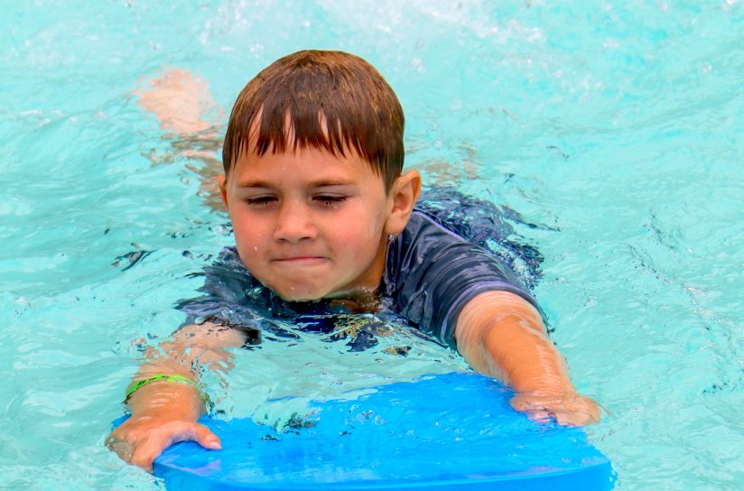 A camper learning how to swim.