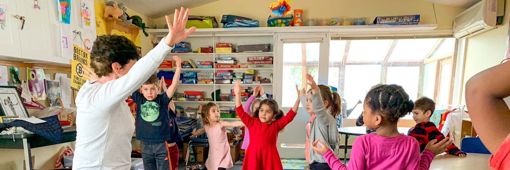 Students stretching in a classroom.