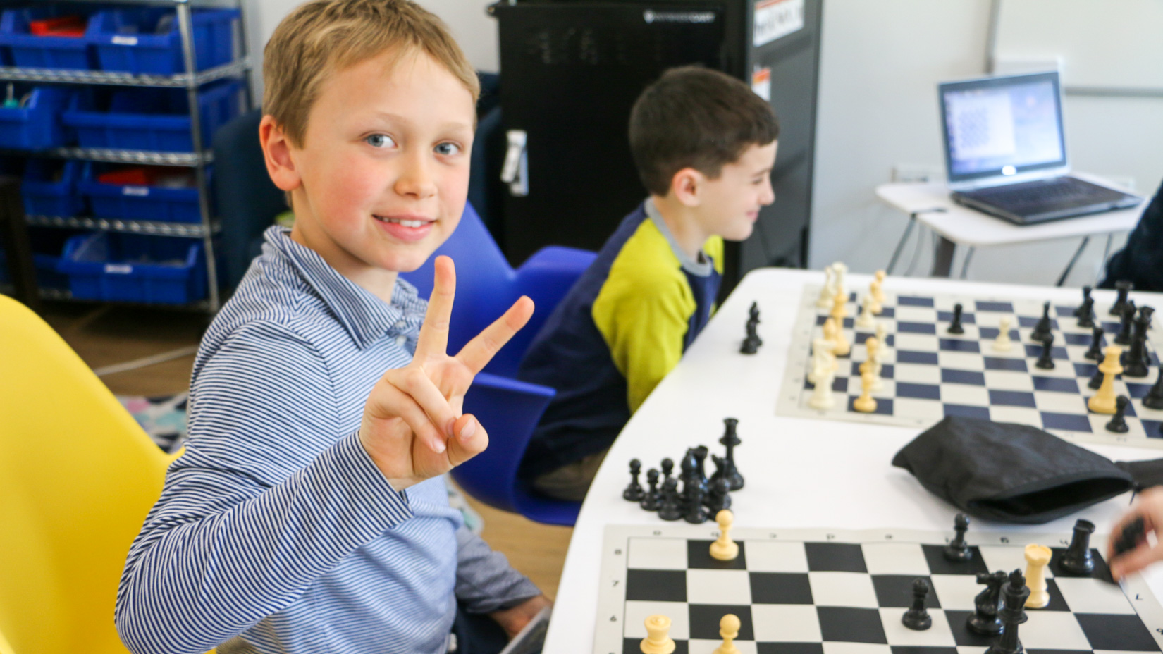 Students playing chess in the after school program.