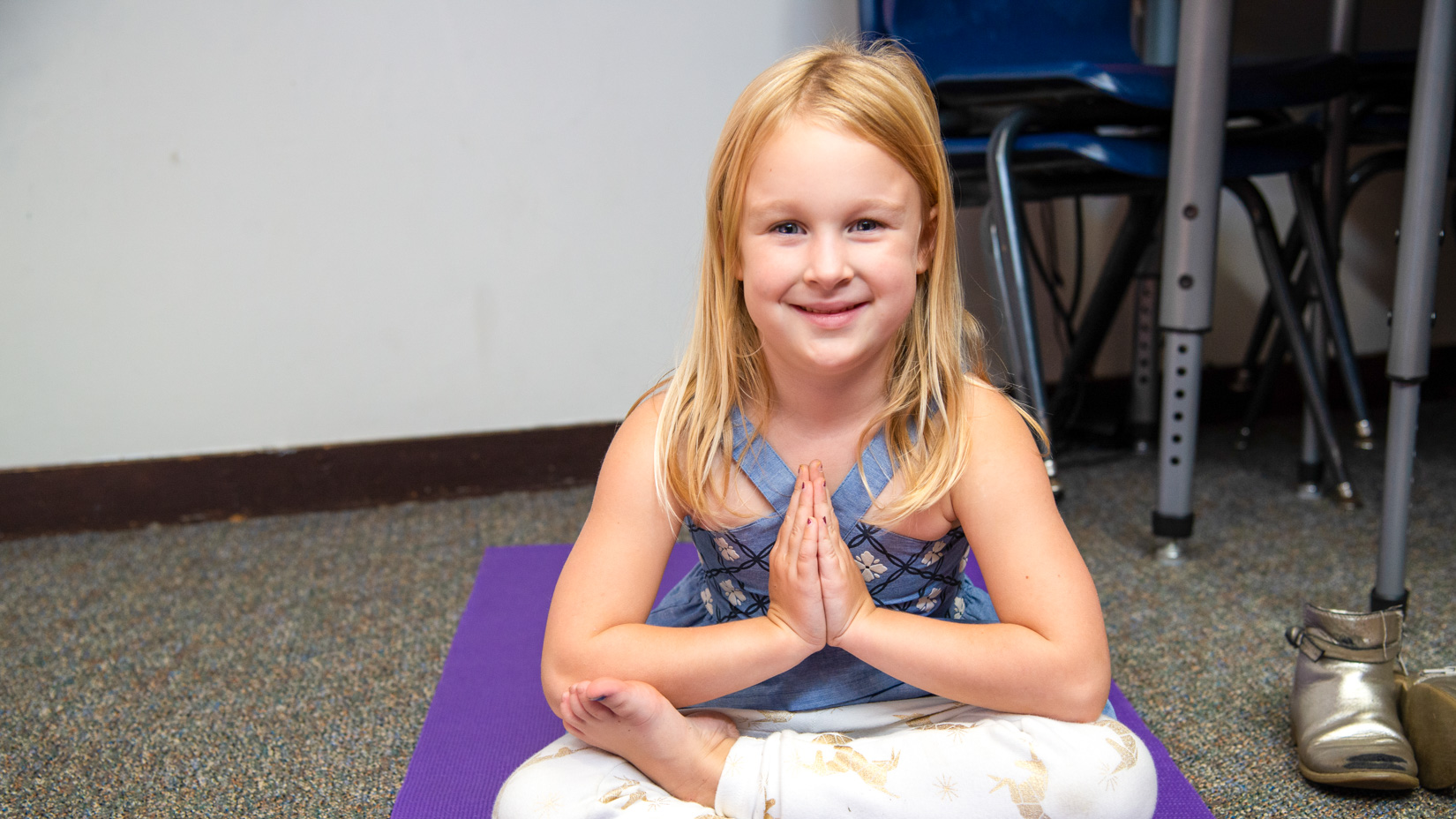 A student stretching after school.