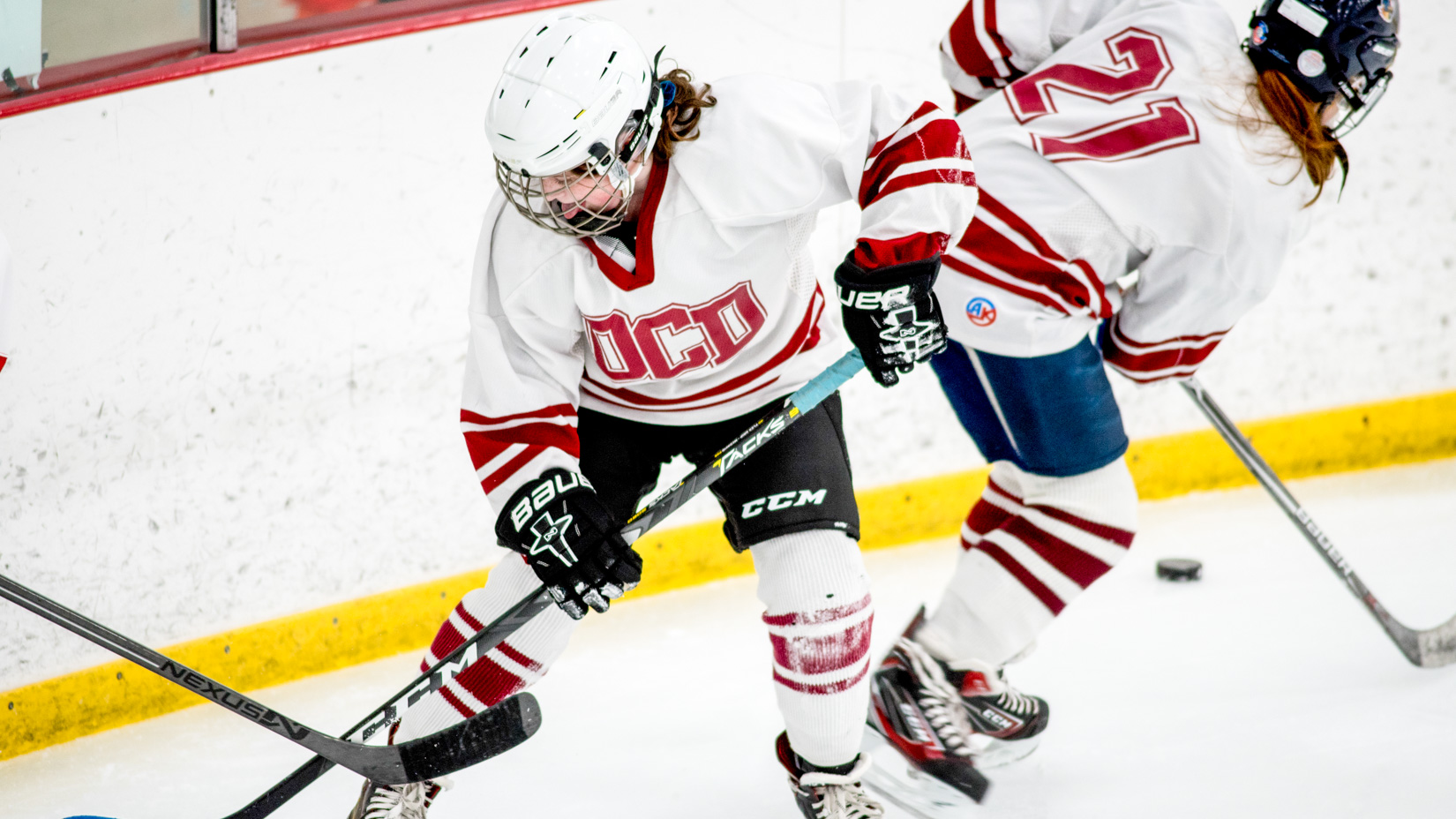 Students playing hockey.