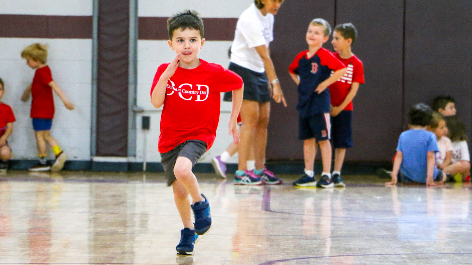 A student running in the gym.