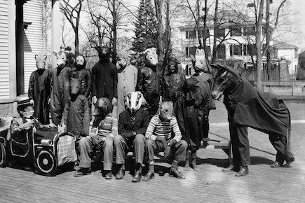 The cast of a play dressed up in costumes.