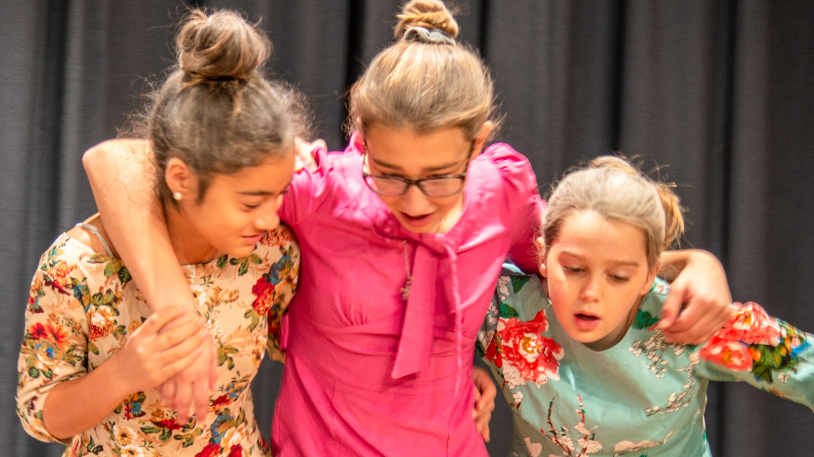 Students performing on stage.