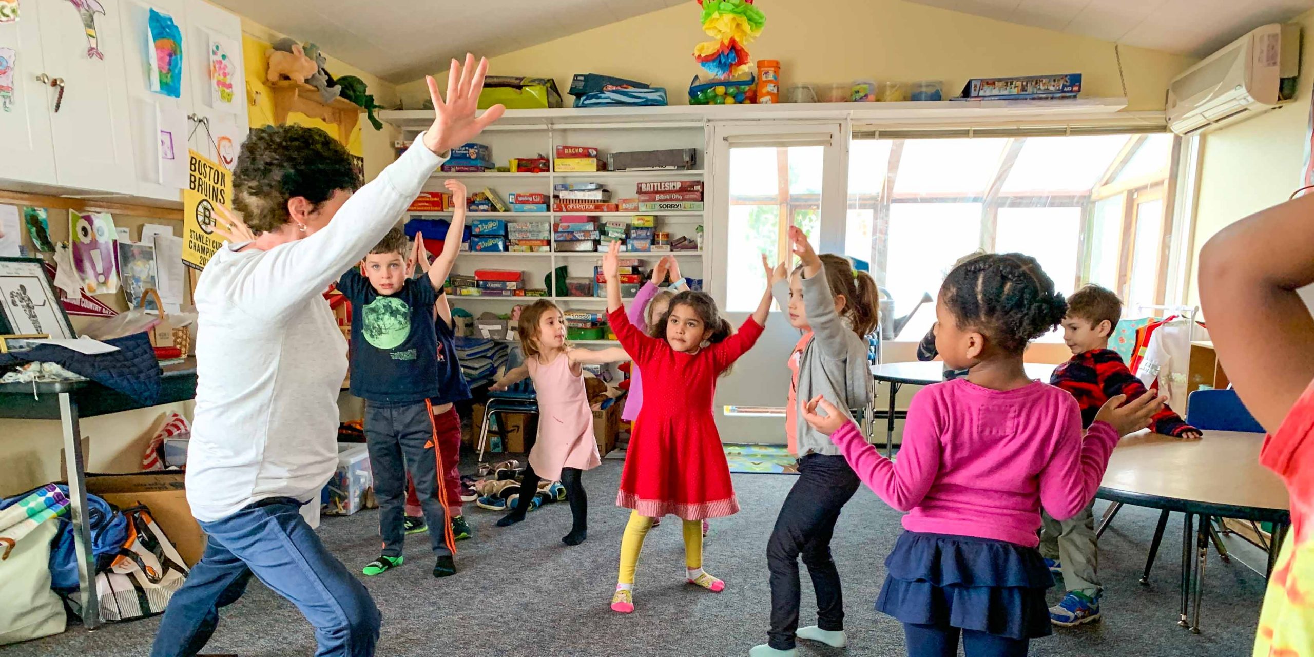 Students stretching in a classroom.