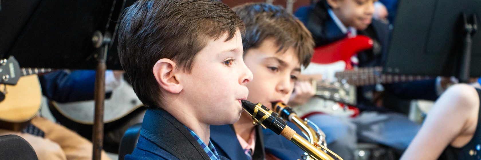 A student playing an instrument during a concert.