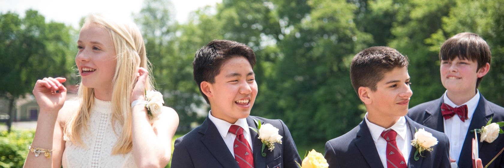 Students smiling during the graduation ceremony.