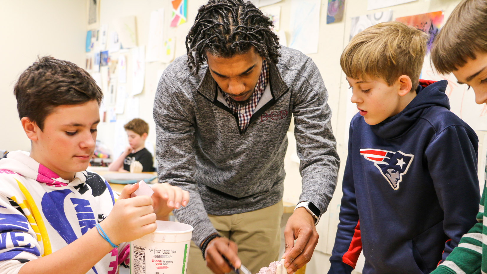 Students learning how to cast sculptures during an art class.