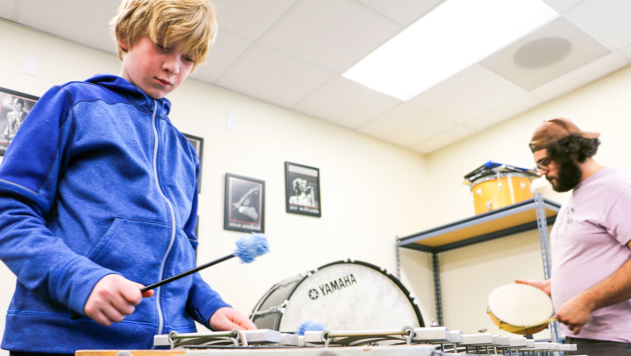 a student playing the drums