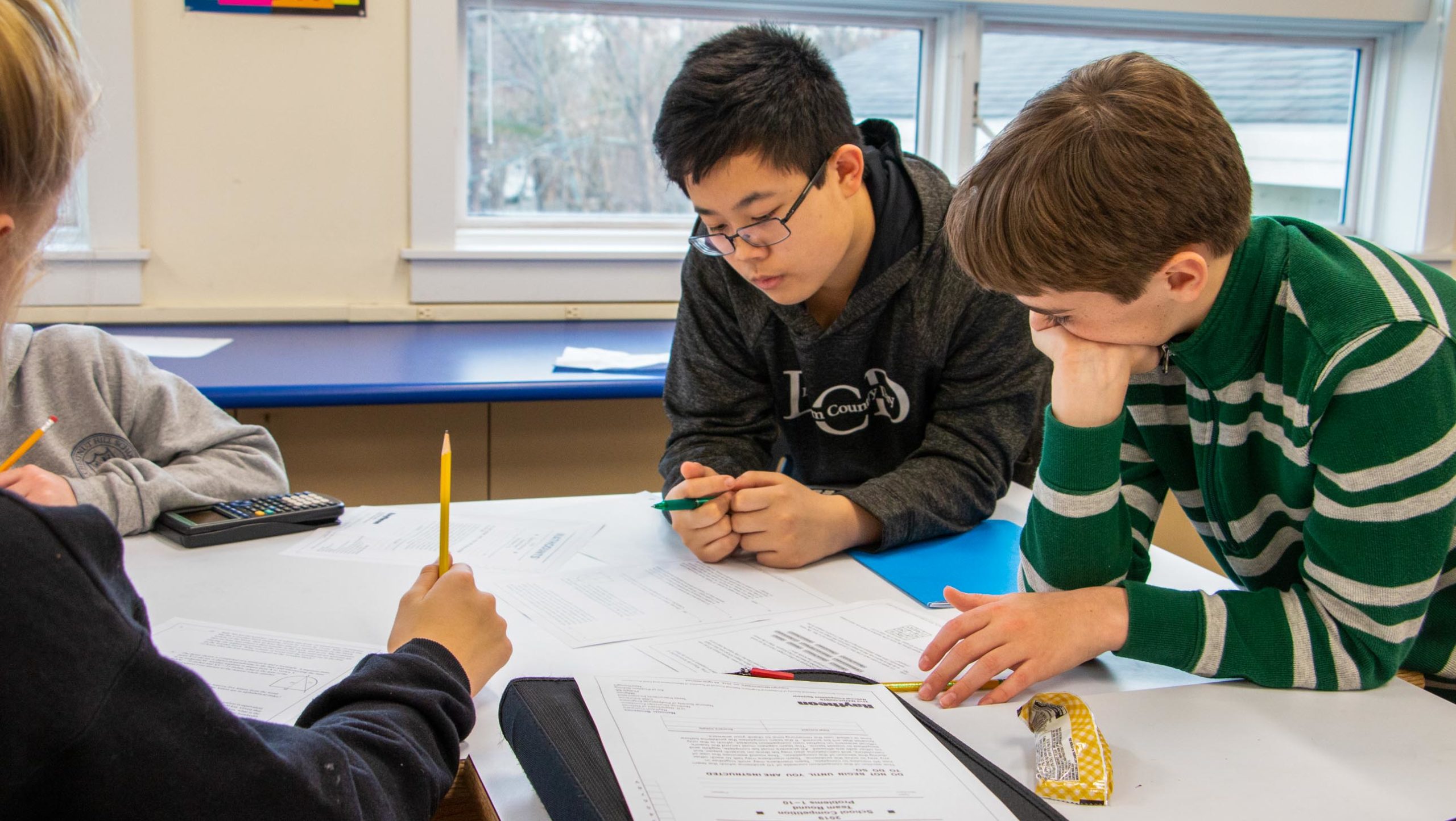 Students in math club working on problems