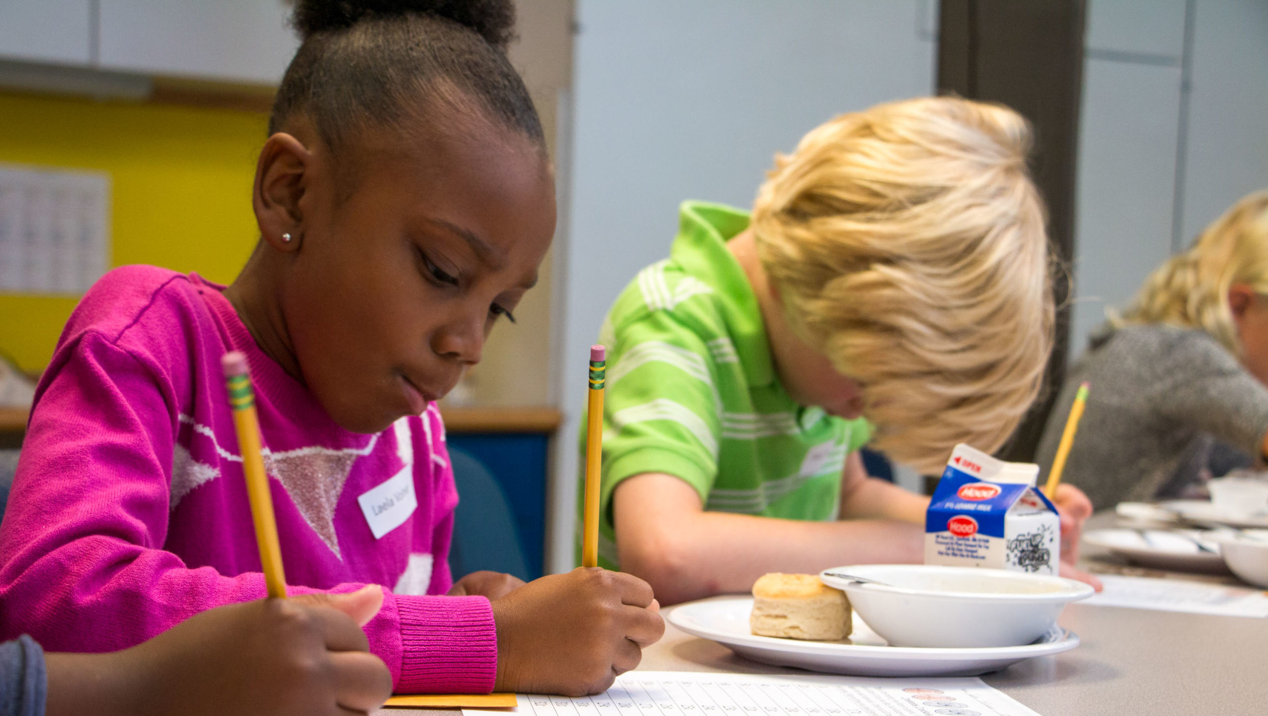 Students working on math at lunch