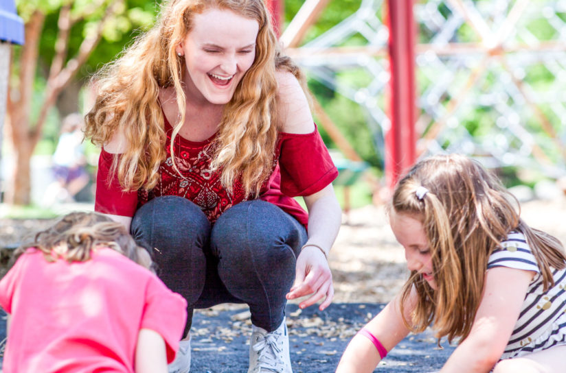 Students playing in the playground and laughing