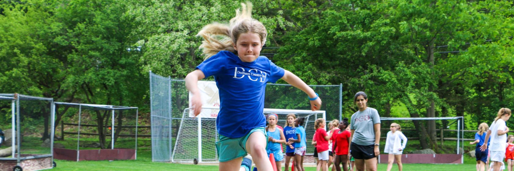 A student practicing her long jump