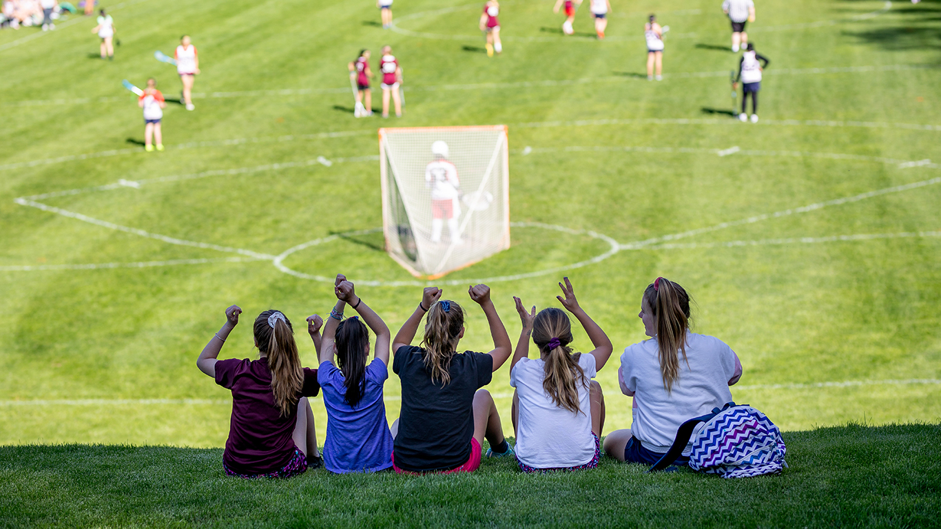 students watching lacrosse game