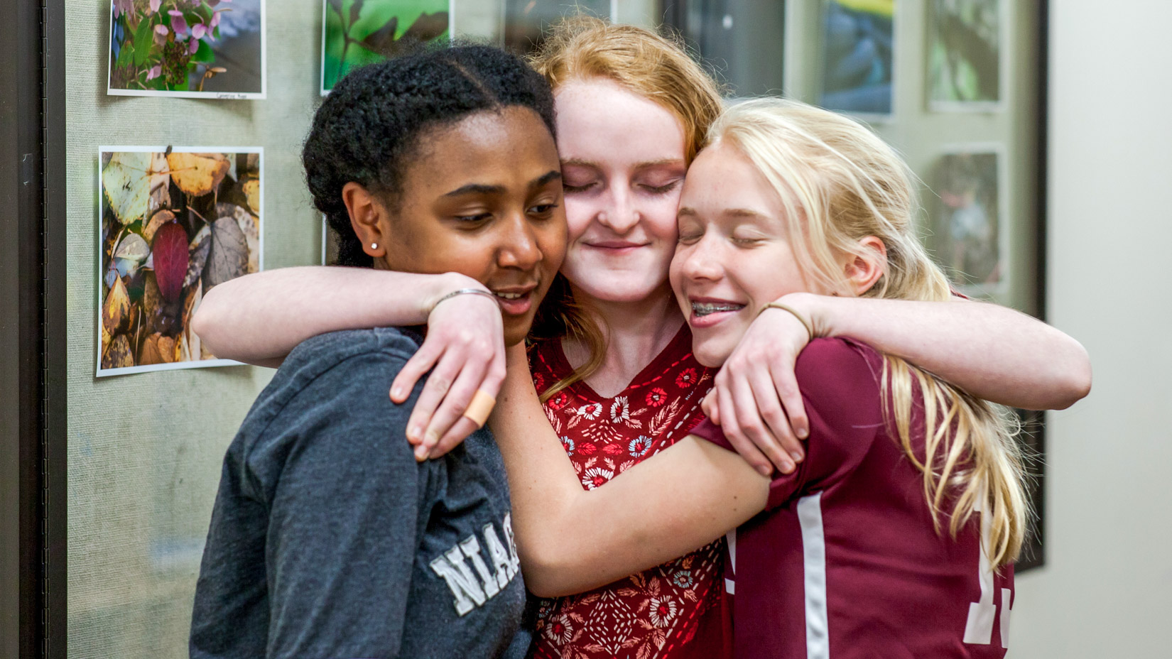 Students hugging and smiling