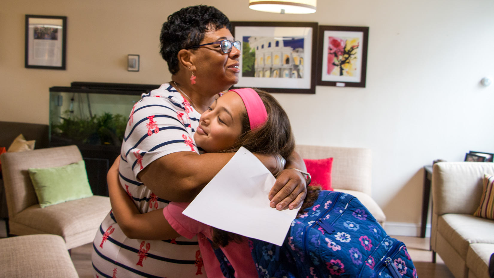 A student hugging a teacher