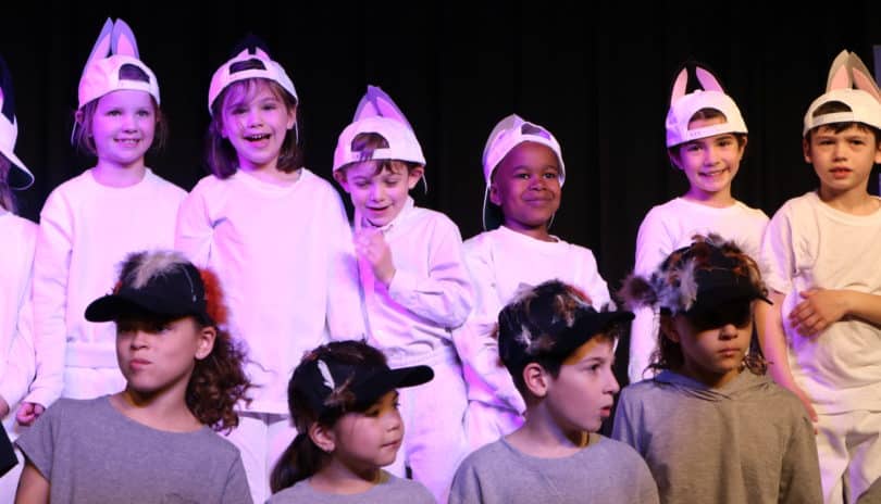 Performers bow at the end of the first grade class play.