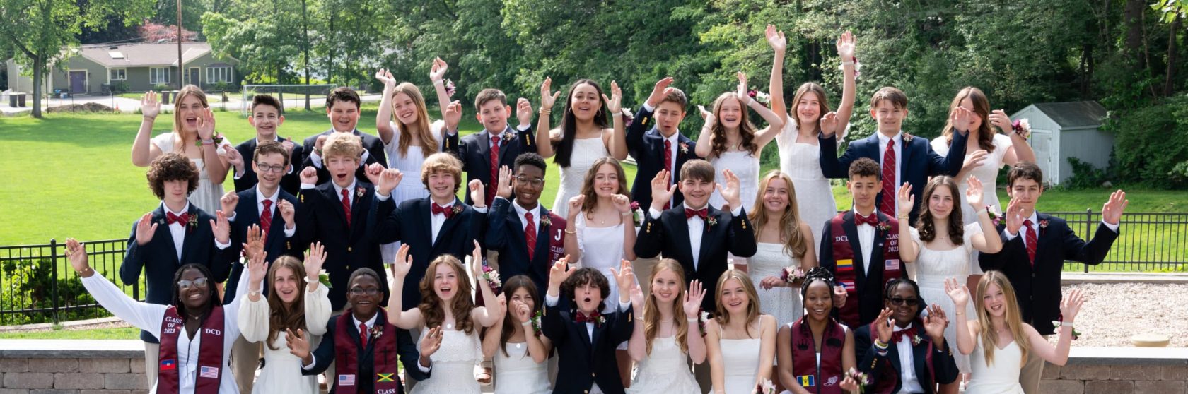 A group of students posing during graduation.