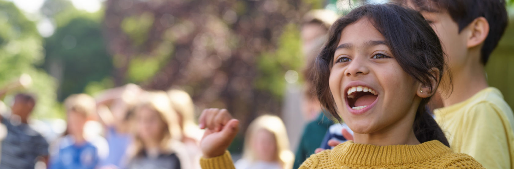 A student cheering for a race.