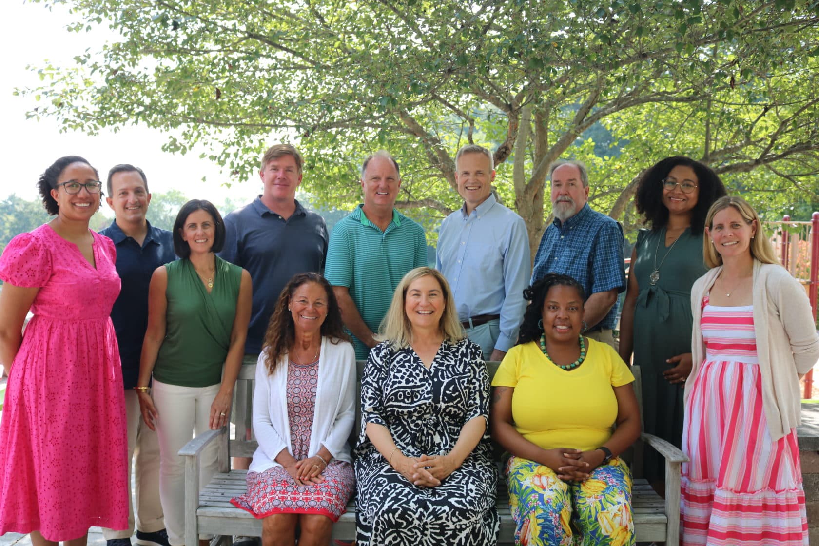 A group of faculty members smiling and posing for a picture.