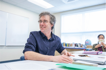 A faculty member in a classroom