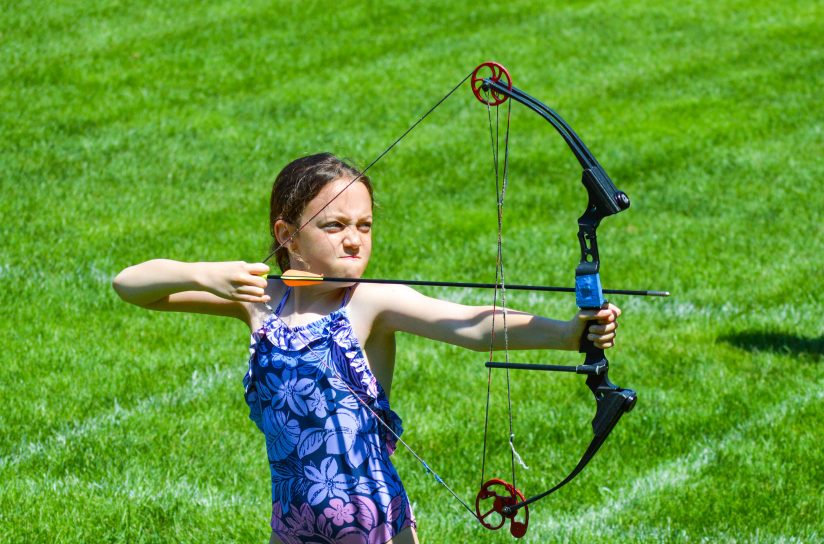 A camper shooting an arrow.