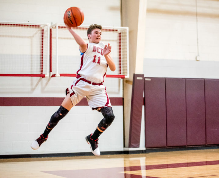 A student playing basketball