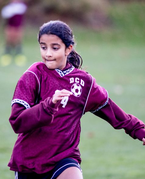 A soccer player focusing on the game.