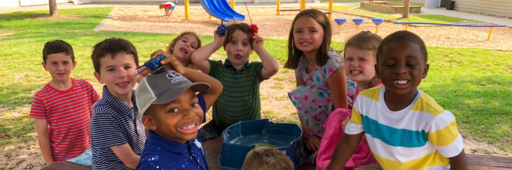 Students sitting in a group outside together.