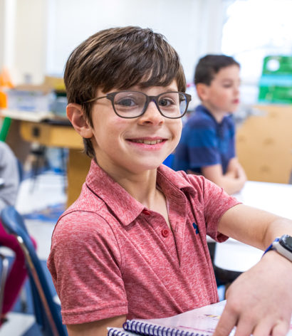 A student smiling at the camera.