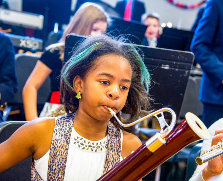 A student playing an instrument during a concert.