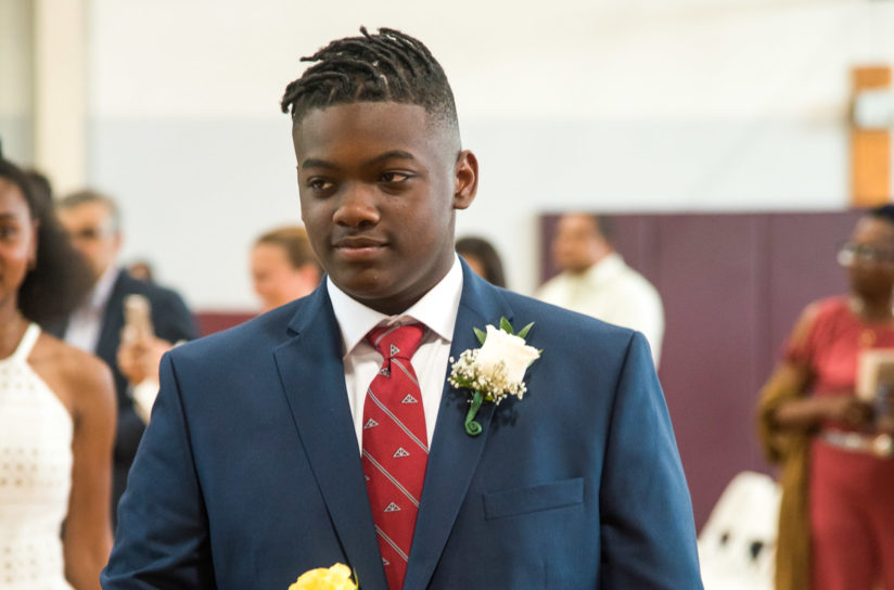 A student walking during graduation