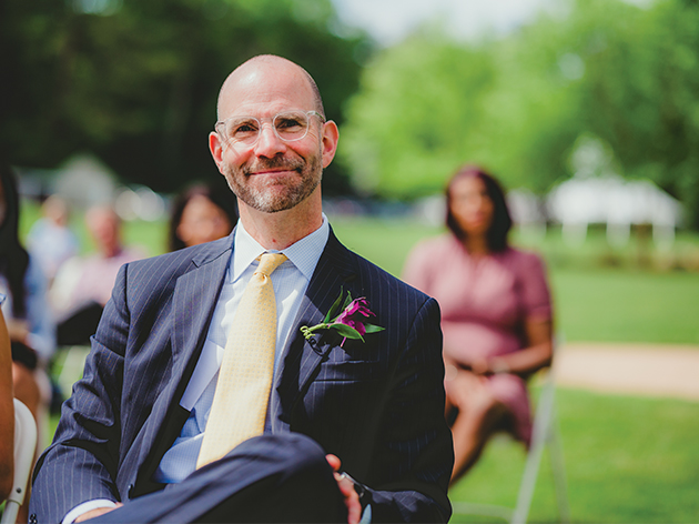 Man sitting in a chair at graduation