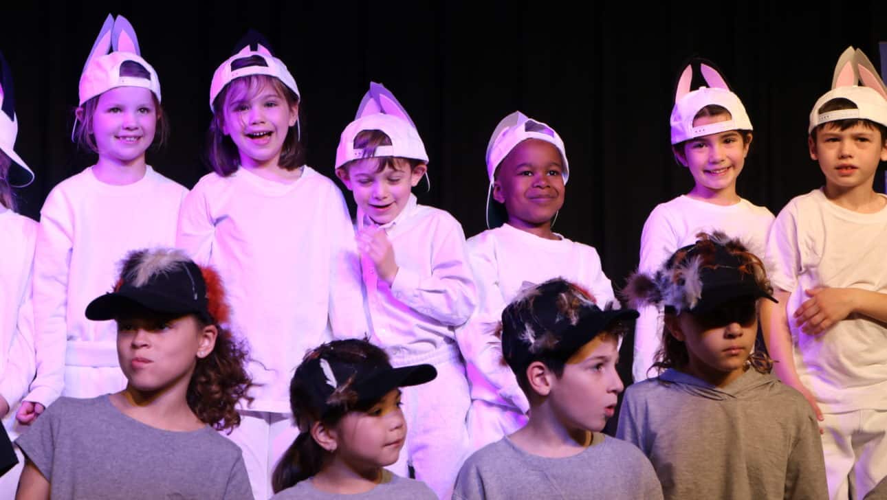 Performers bow at the end of the first grade class play.